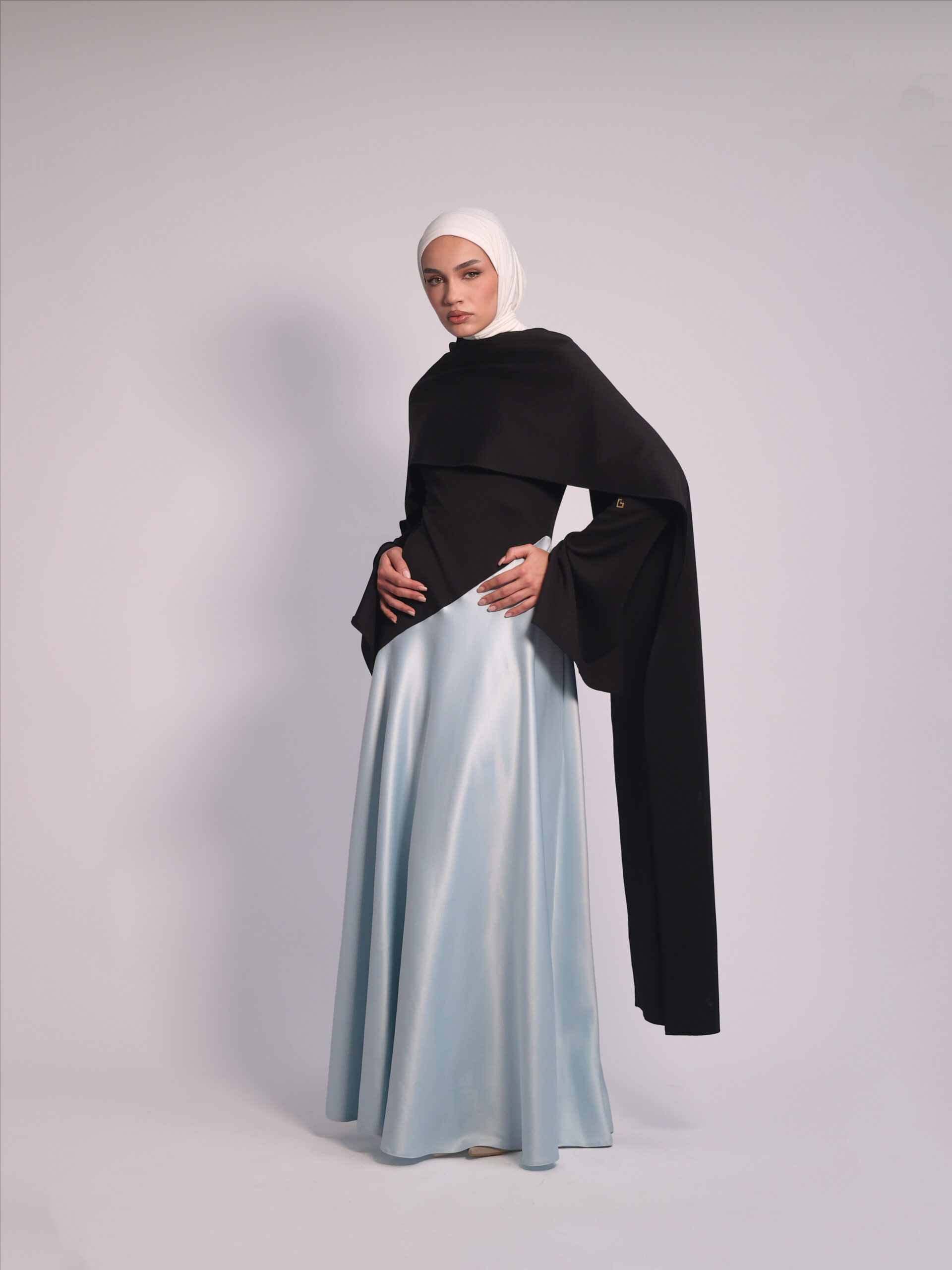 Contrast Flow Dress by Kharzaat featuring an adjustable scarf, lightweight black bodice, and flowing matte satin skirt