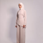 Asymmetrical Layer Set by Kharzaat features an elegant asymmetrical top with matching wide-leg pants. Available in Pink, Mint Green, and Baby Blue from the SS26 Collection.